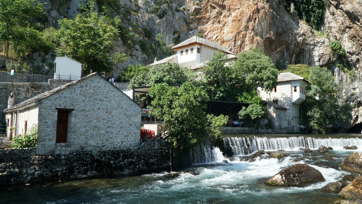 Blagaj Tekke, a historic dervish lodge beside the Buna River spring at the base of a cliff