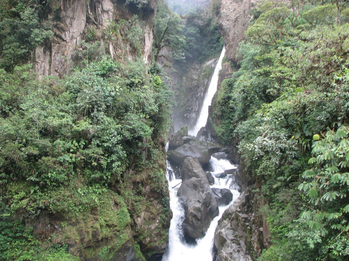 Pailón del Diablo waterfall surrounded by lush vegetation near Baños, Ecuador