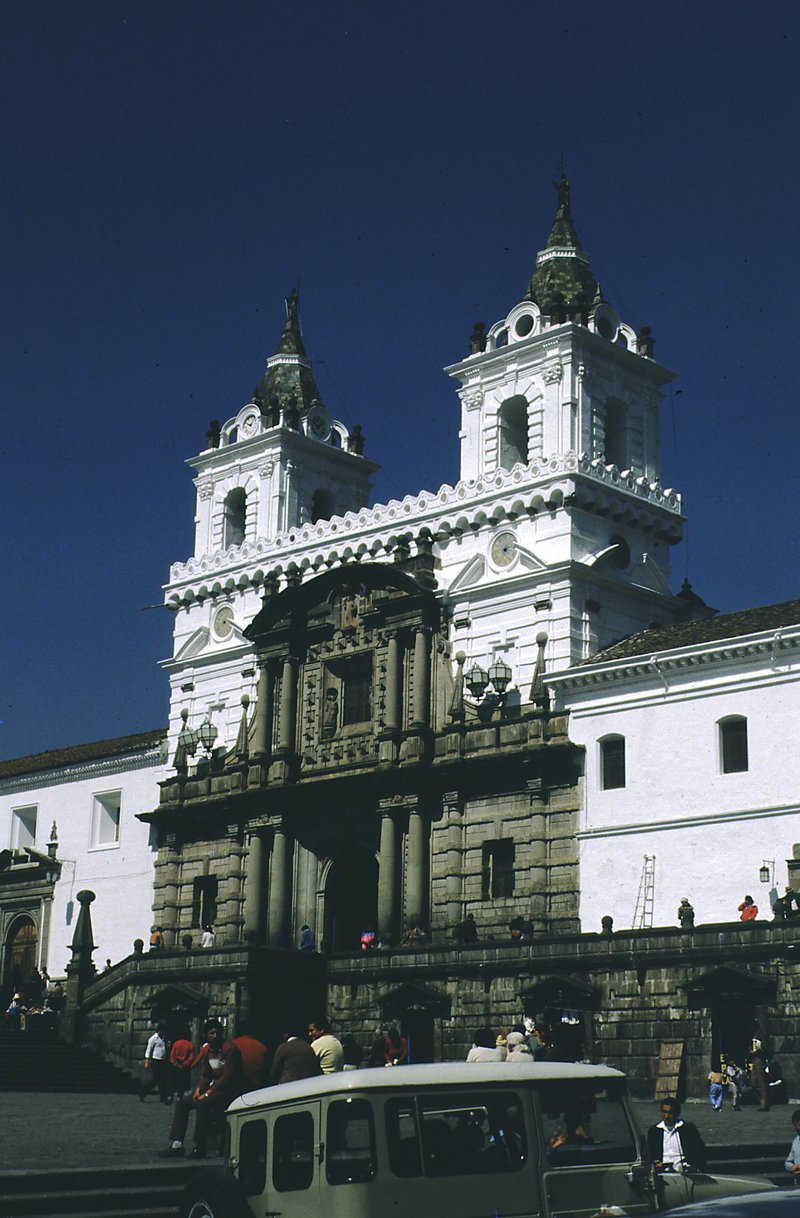Colonial streets and plazas in Quito’s historic centre, with mountains beyond