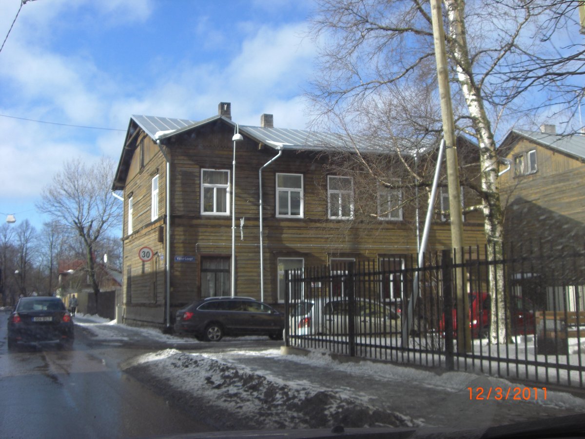 Wooden house on a snowy street in Kalamaja, Tallinn