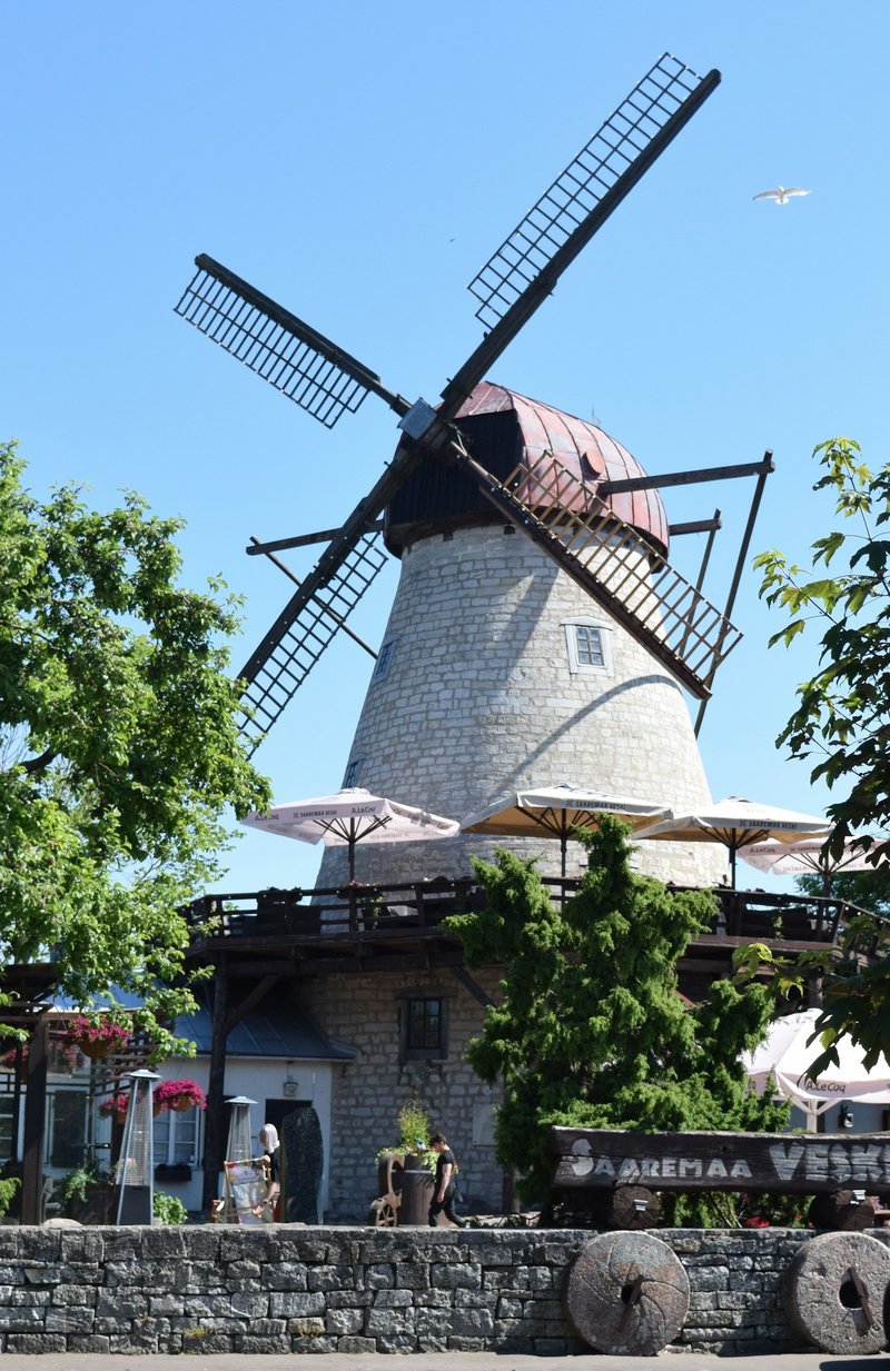 Limestone windmill in Kuressaare, Saaremaa, with a restaurant terrace at its base