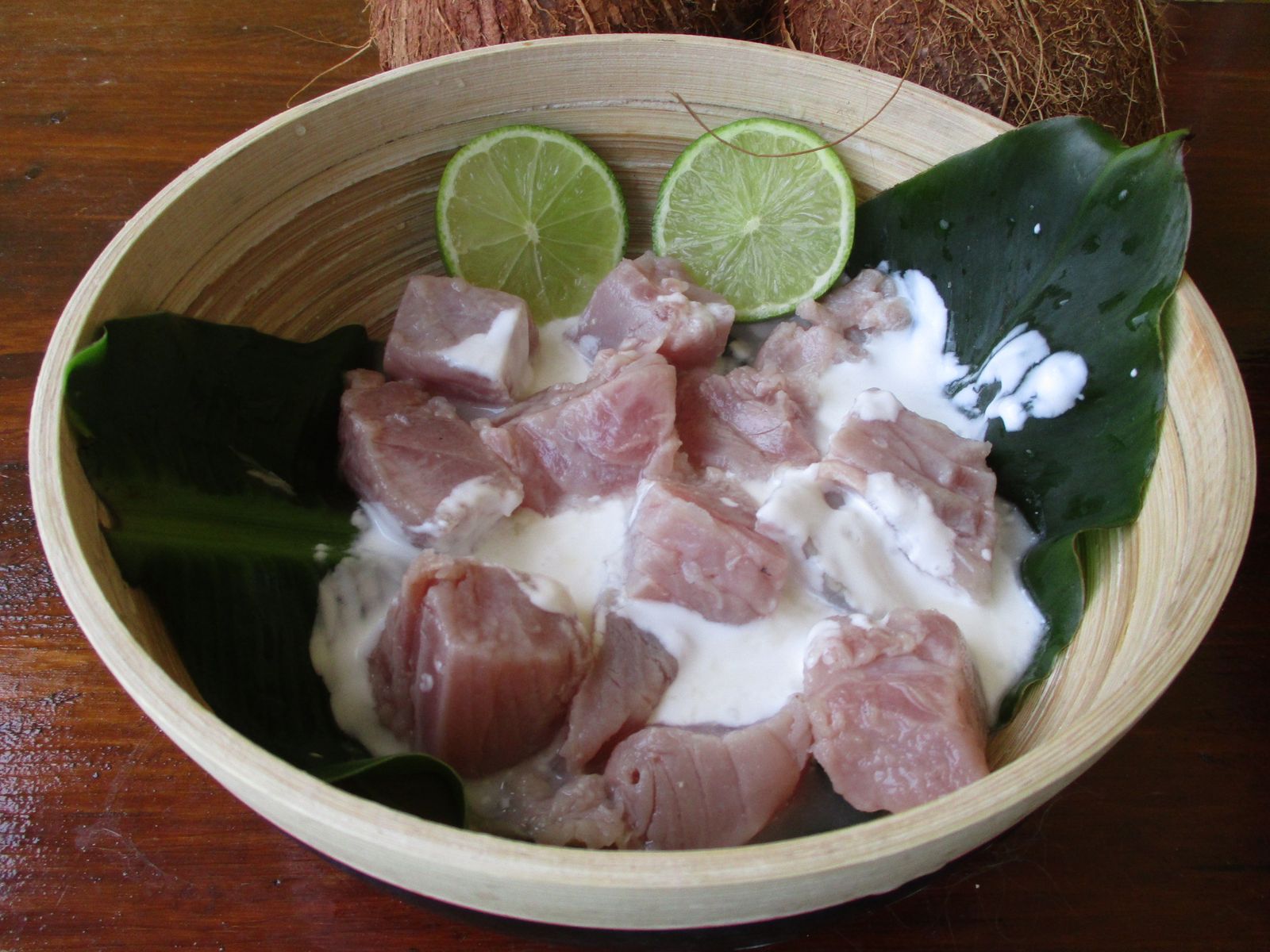 Bowl of poisson cru à la tahitienne with raw fish, coconut milk, lime and vegetables