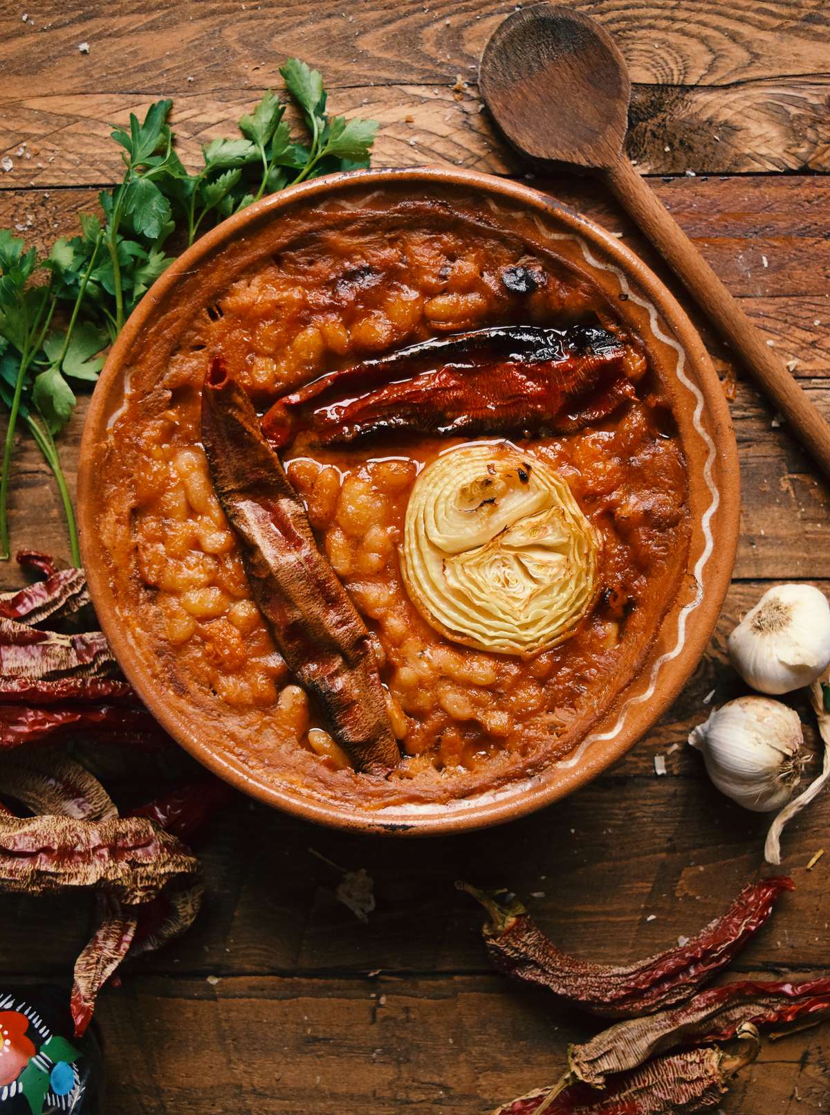 Tavče gravče, a traditional Macedonian baked bean dish served in a ceramic dish