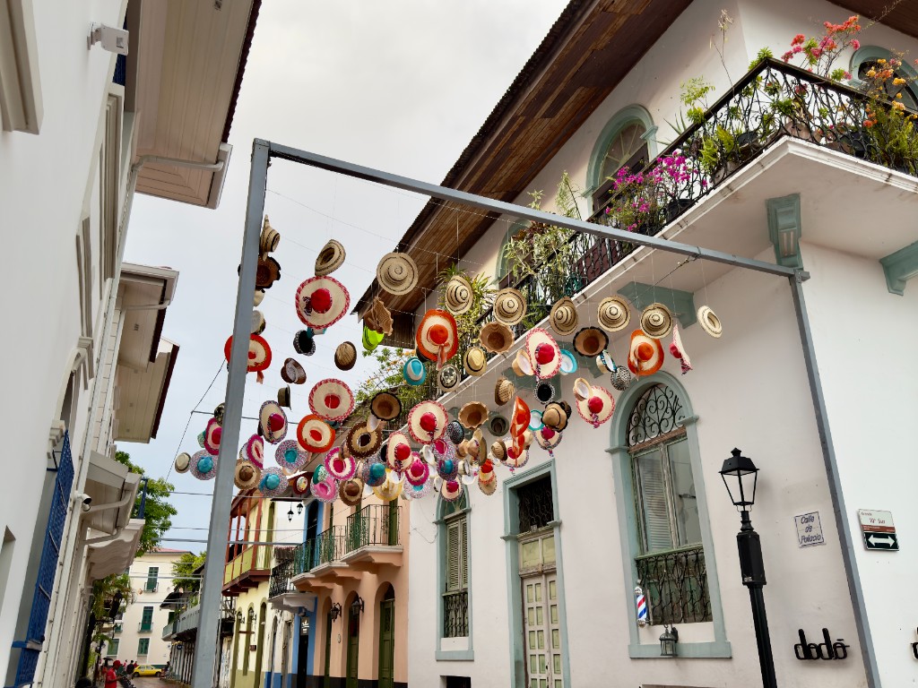 Historic Casco Viejo street in Panama City with colourful hats and colonial balconies