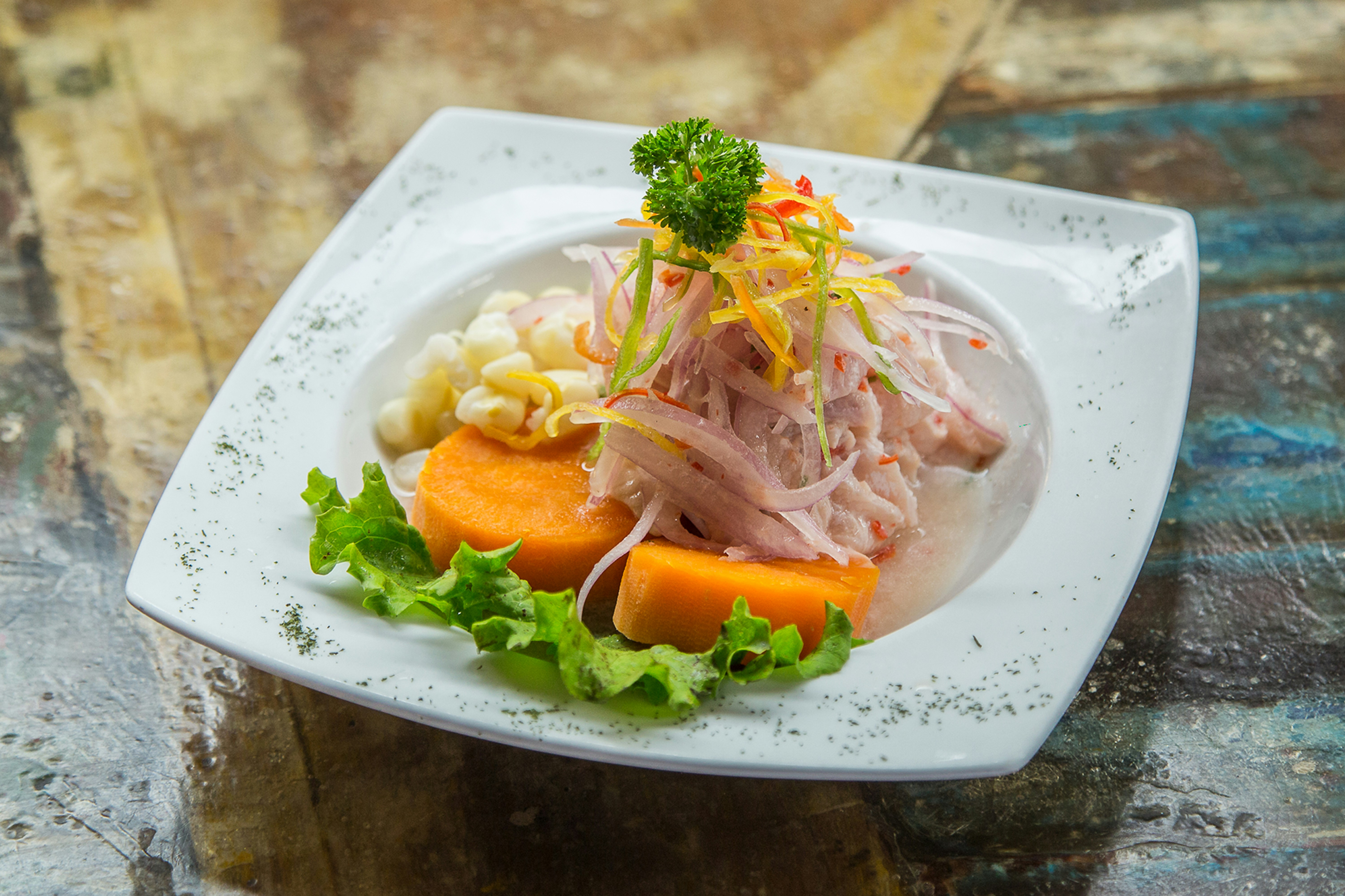 Fresh Peruvian ceviche served with corn and sweet potato