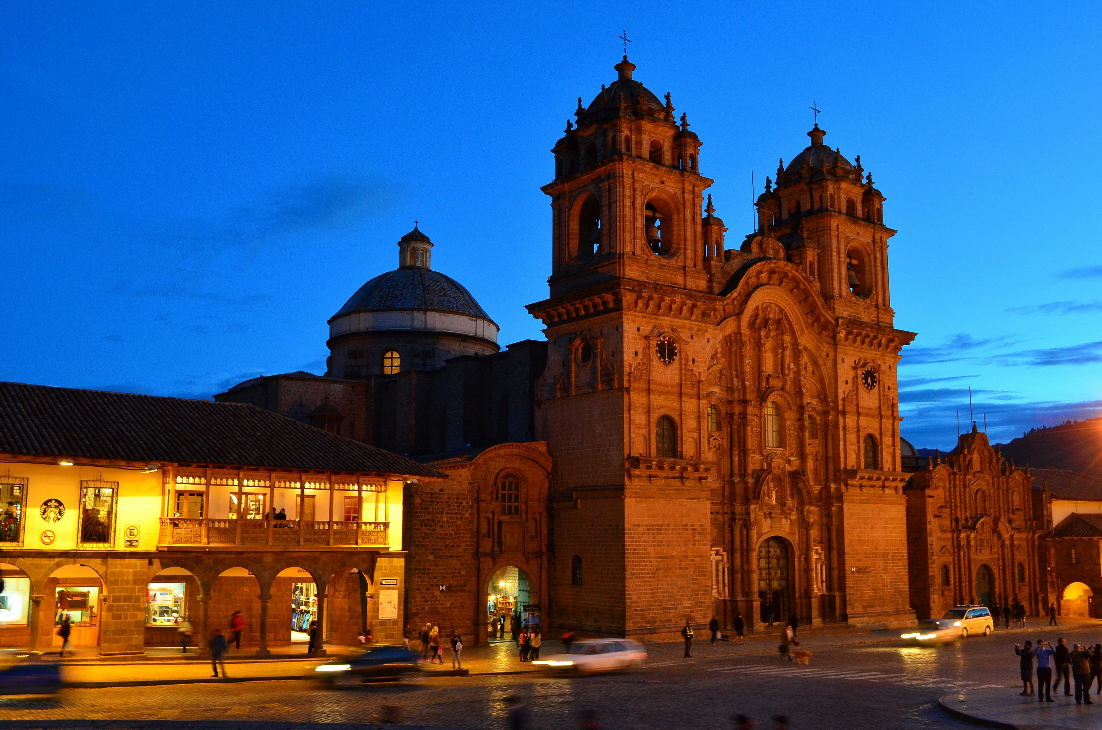 Cusco Plaza de Armas with cathedral and mountain backdrop