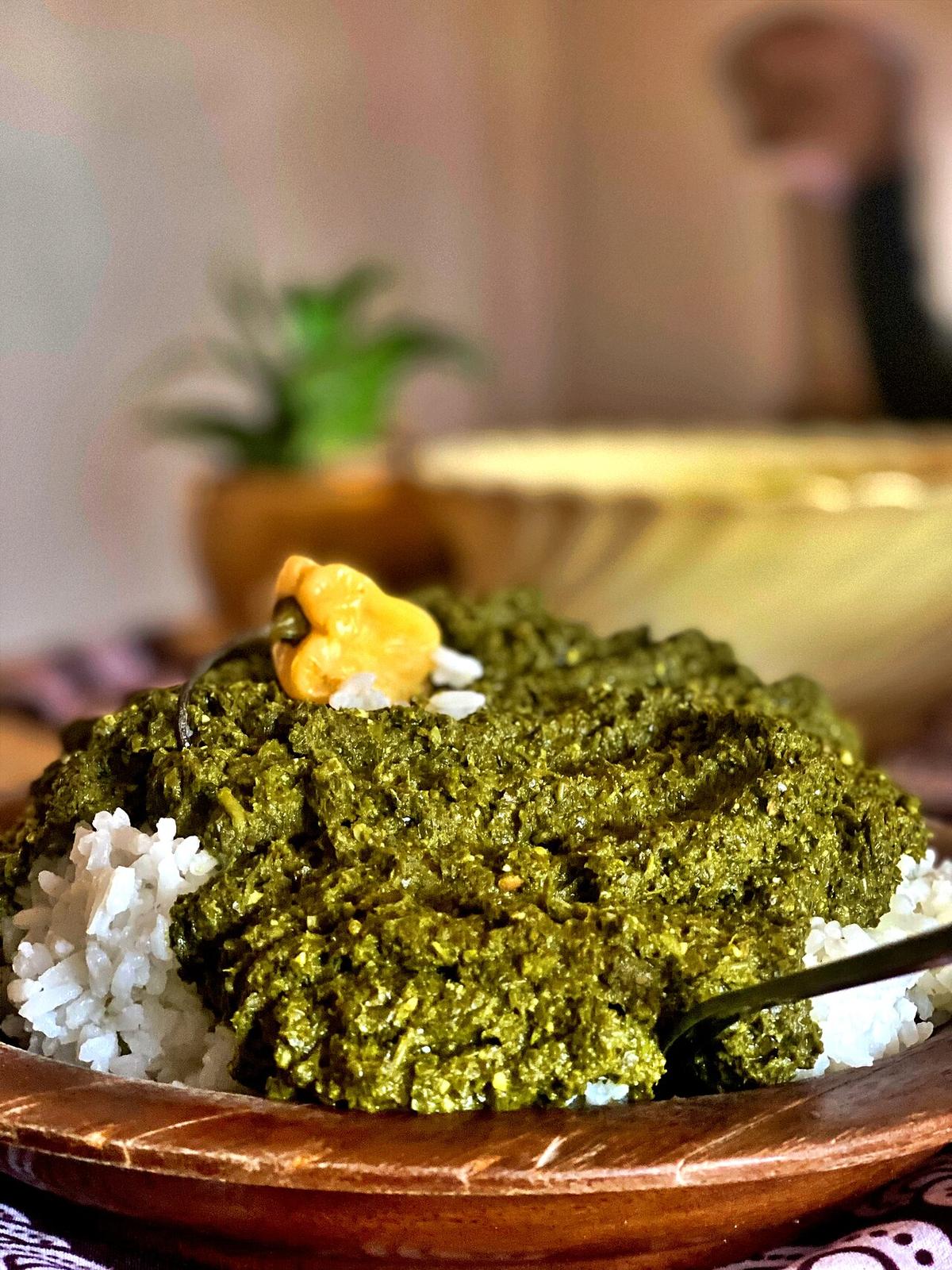 Plate of isombe, a Rwandan cassava leaf dish