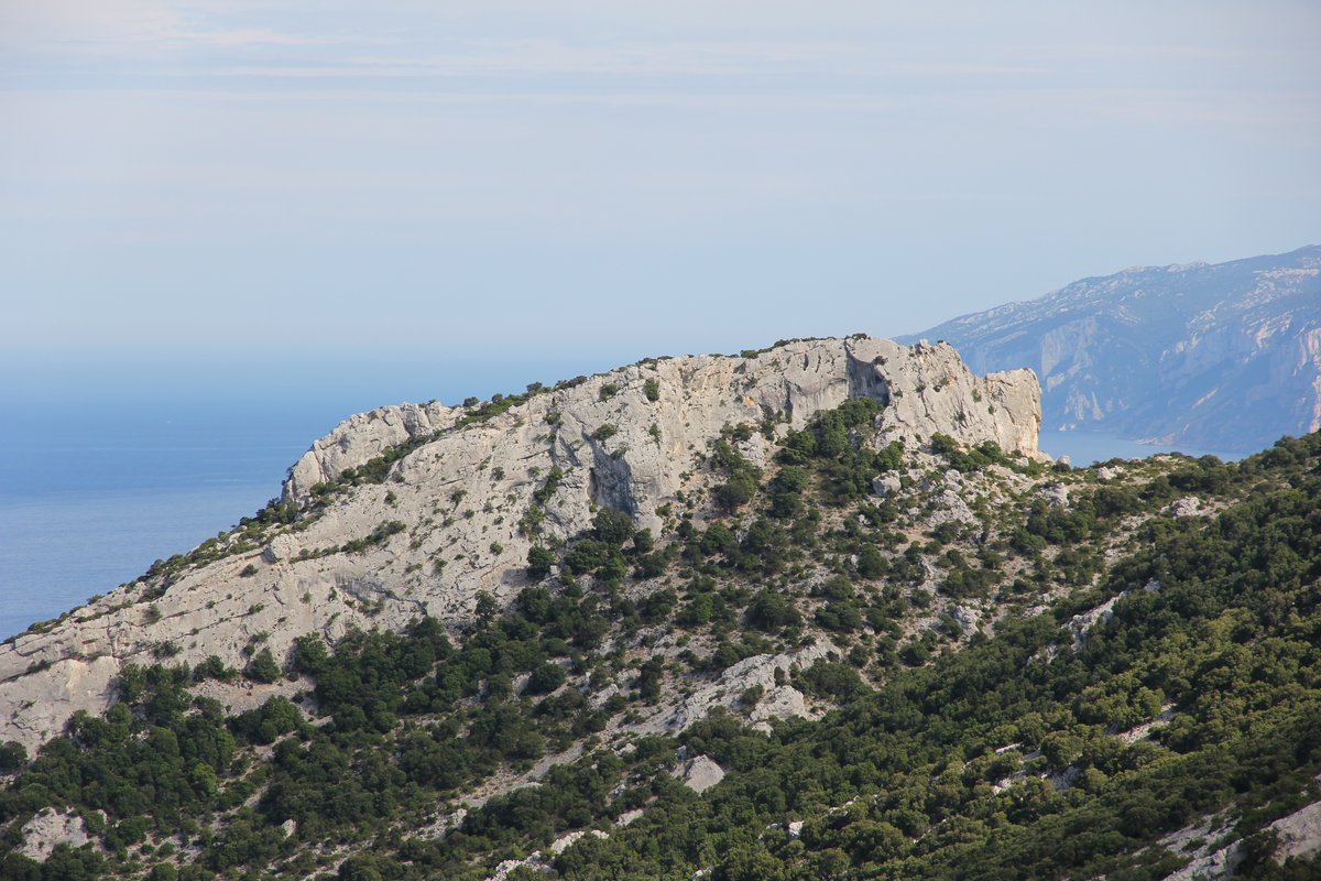 Rugged limestone cliffs and clear Mediterranean water along the Gulf of Orosei on Sardinia’s east coast